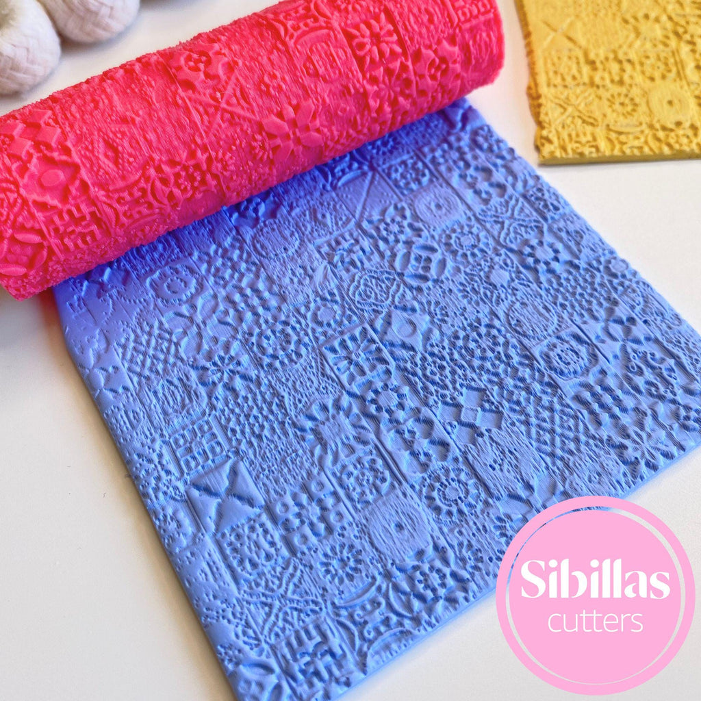 Three embossed silicone mats in pink, blue, and gold with 'Sibillas cutters' branding.