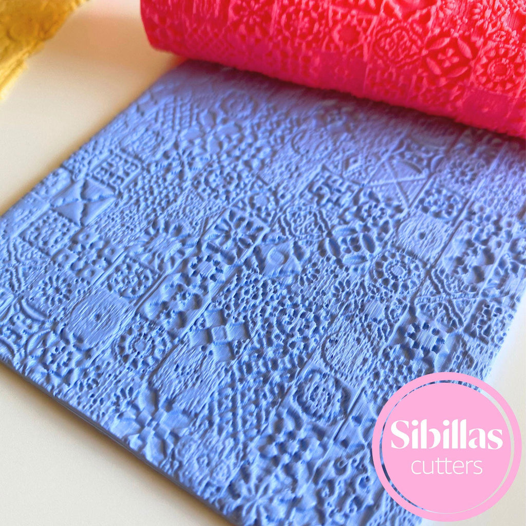 Clay embossing roller with Moroccan tile pattern for handmade polymer clay crafts