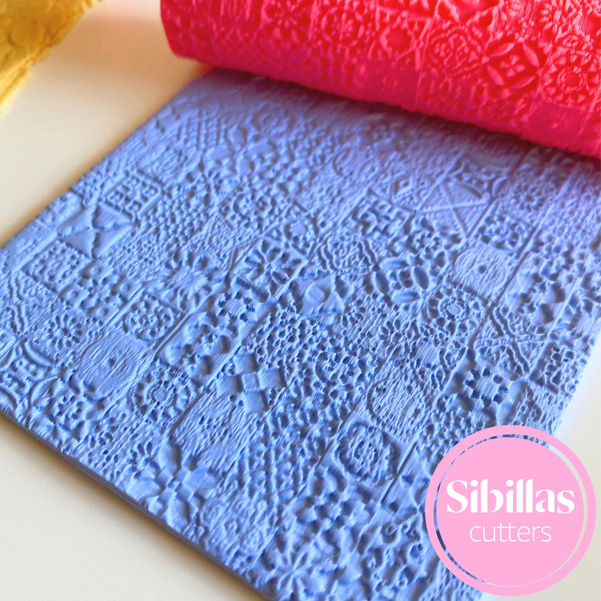 Clay embossing roller with Moroccan tile pattern for handmade polymer clay crafts