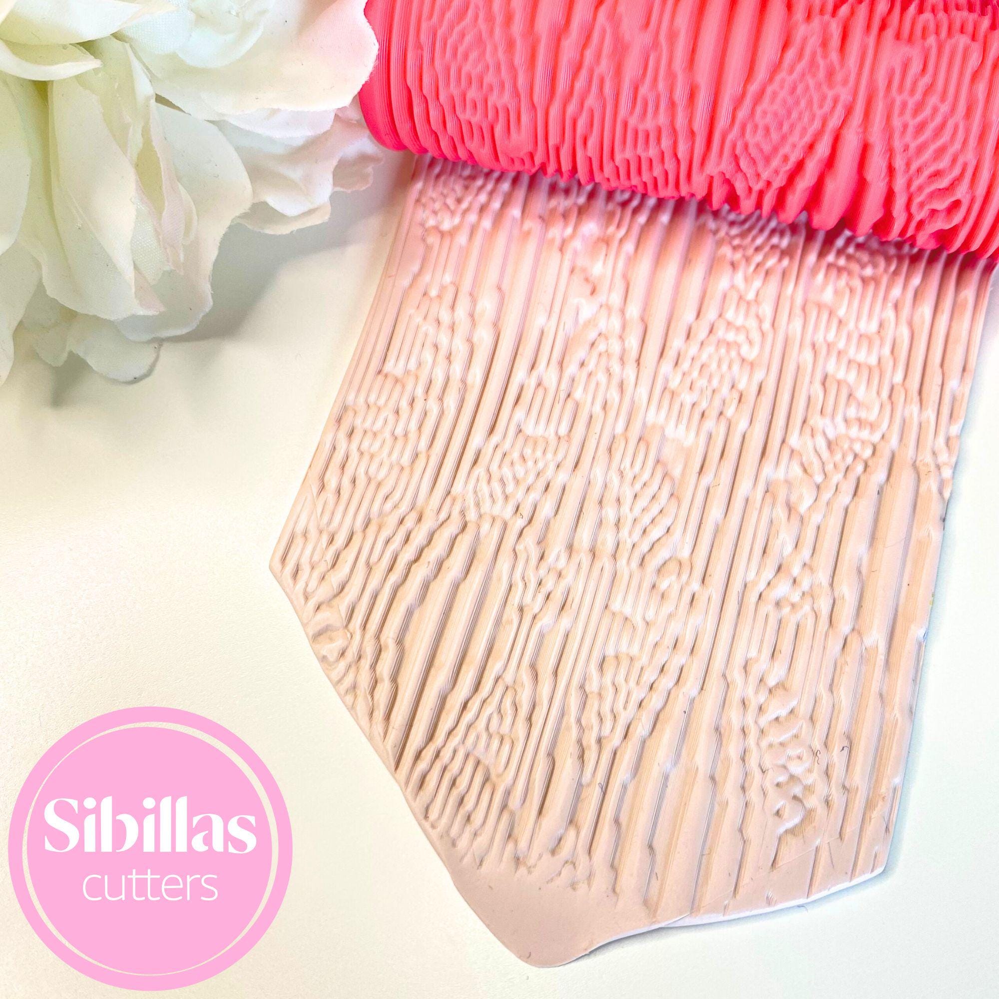 Polymer clay embossing roller with modern abstract line pattern for crafts