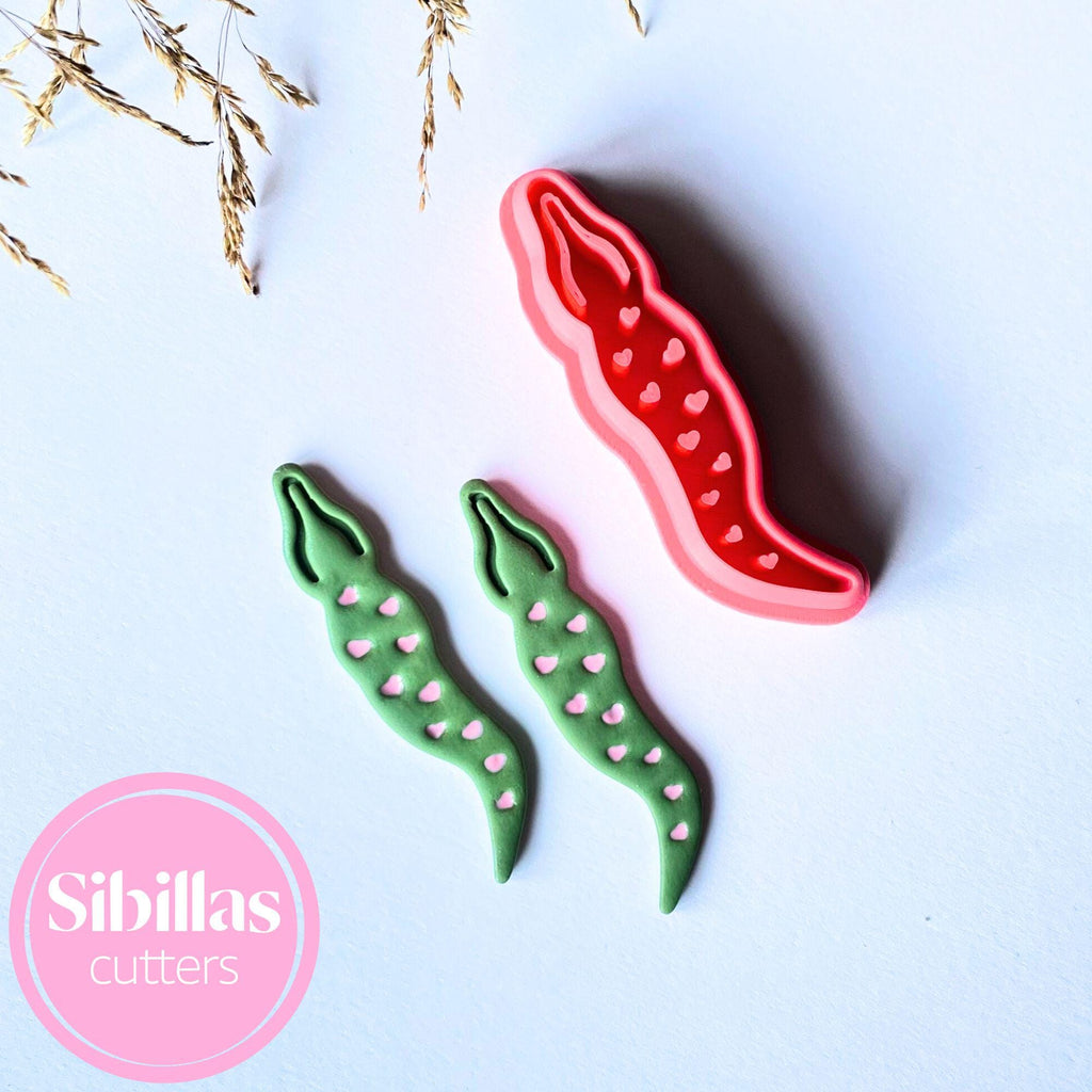 Alligator-shaped clay cutter with heart details for polymer clay, fondant, and crafts