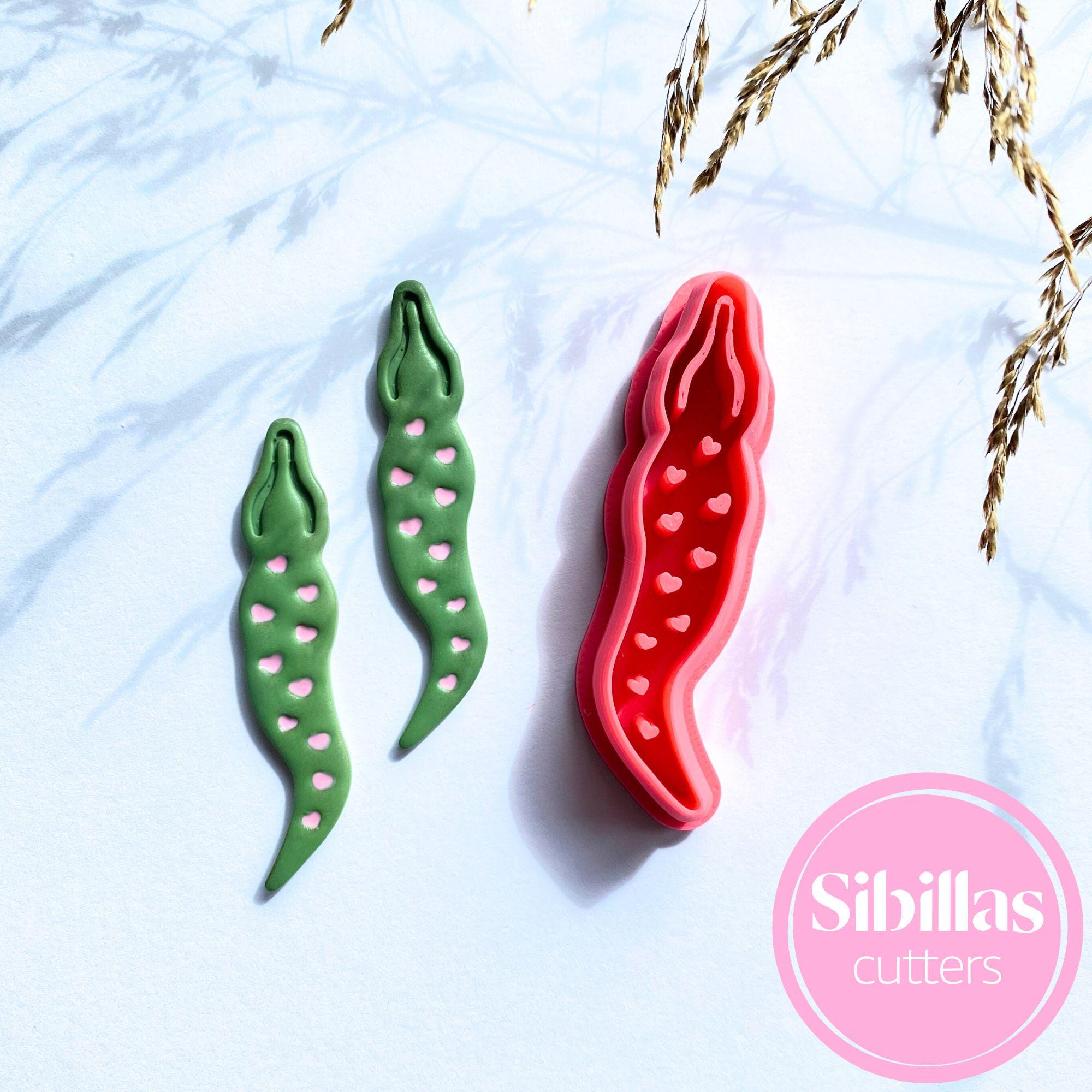 Alligator-shaped clay cutter with heart details for polymer clay, fondant, and crafts