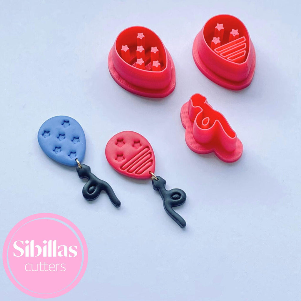 Set of colorful cookie cutters with various shapes on a light blue background, branded 'Sibillas cutters'.