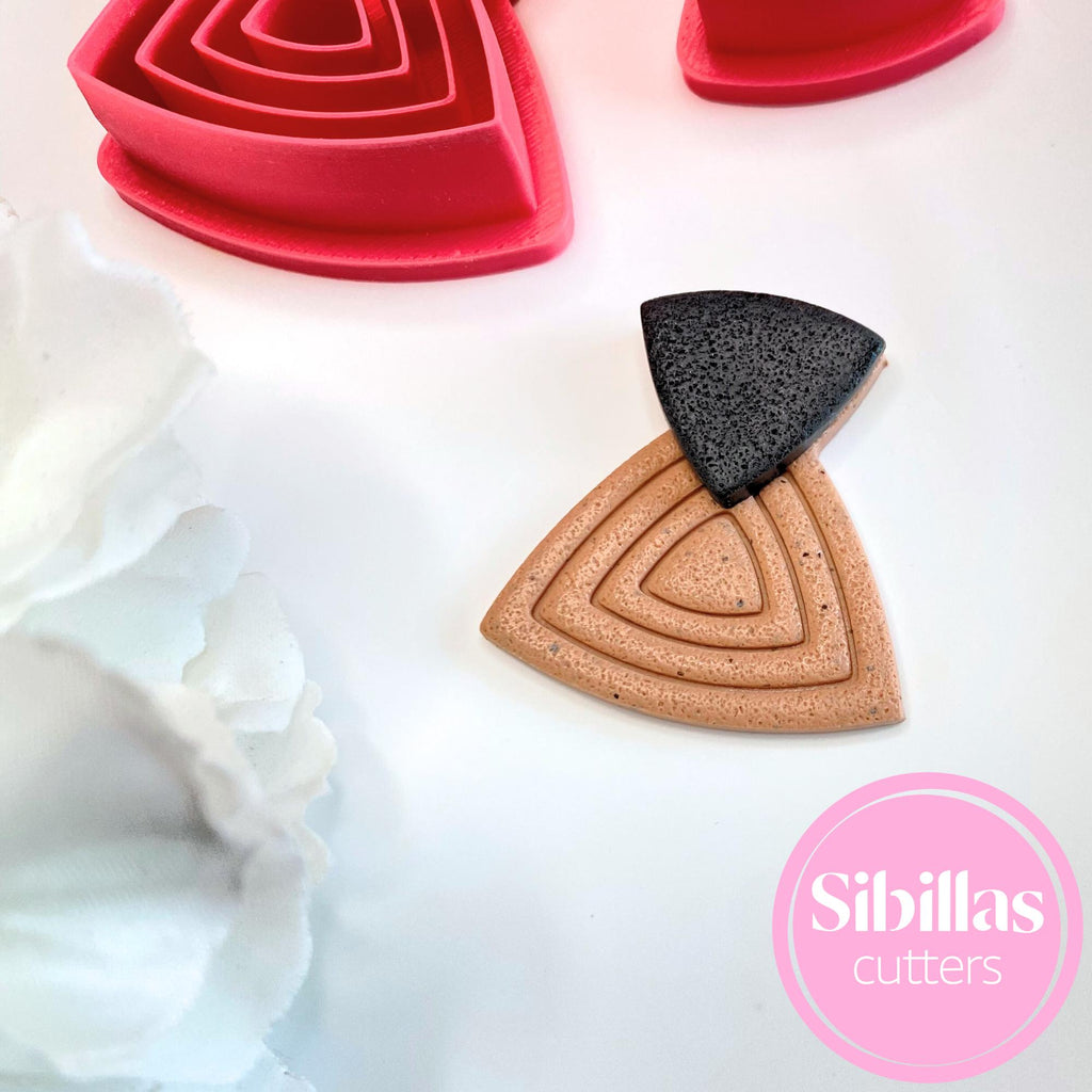 Triangle-shaped clay cutter with embossed design for polymer clay projects