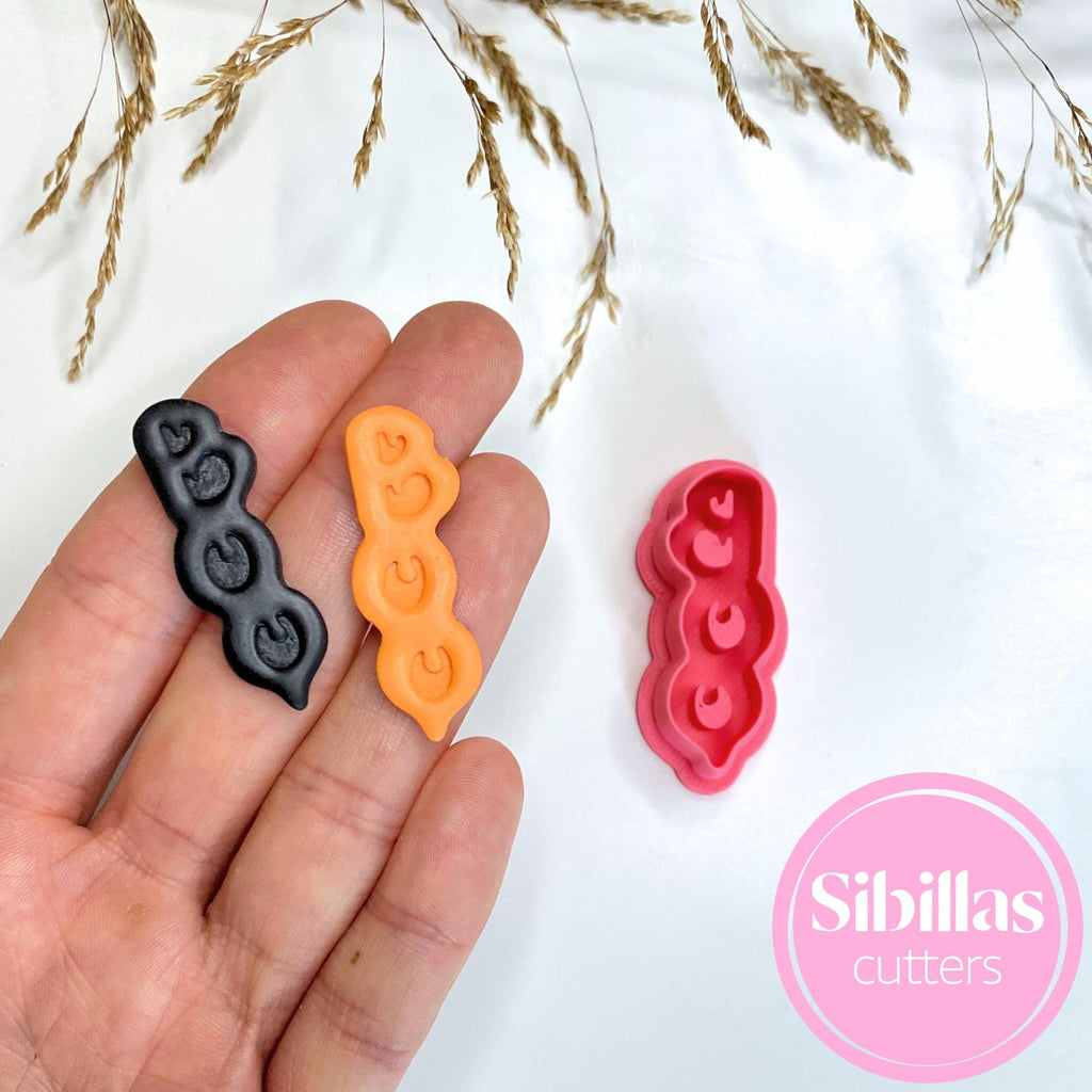 Festive polymer clay cutter with Boo Halloween design for earrings and charms"