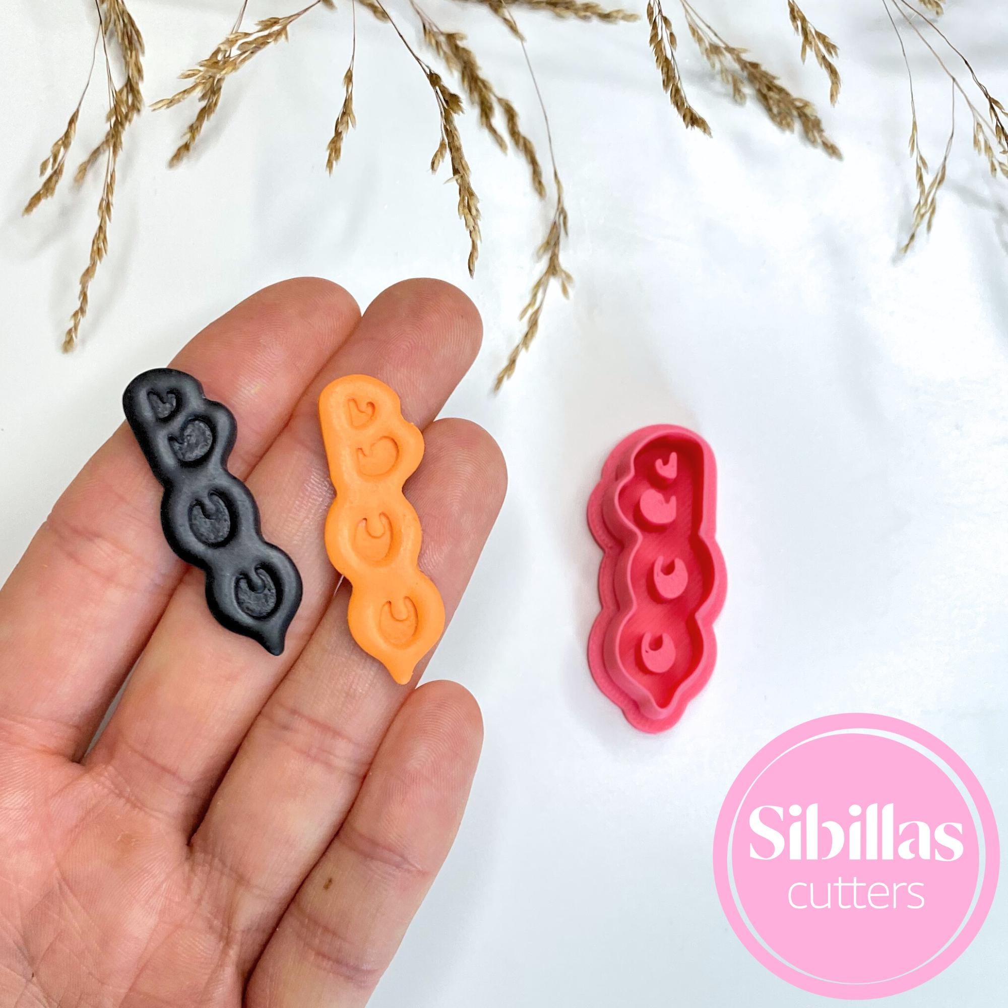 Festive polymer clay cutter with Boo Halloween design for earrings and charms"