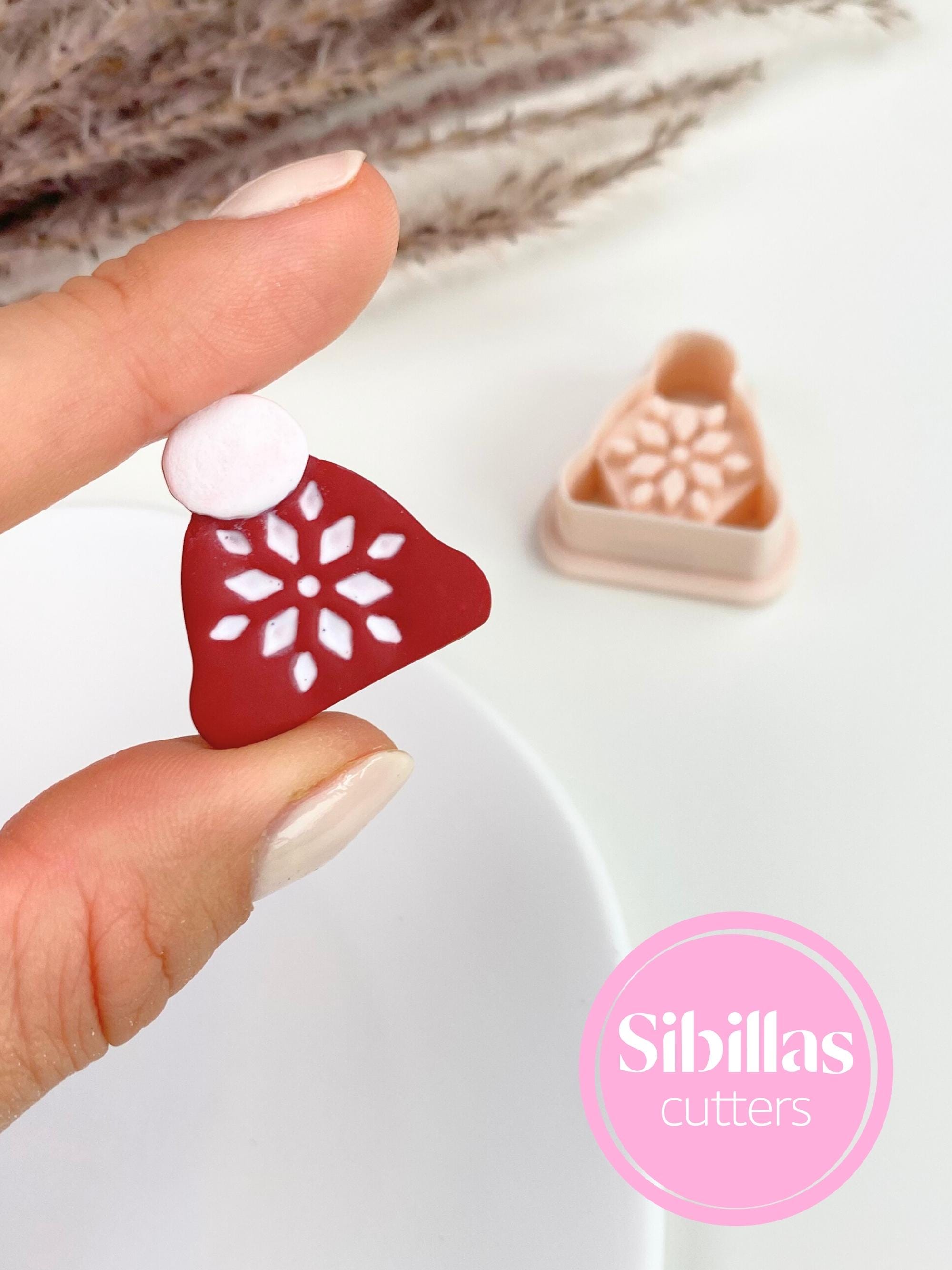 Christmas hat polymer clay cutter shaped like a winter beanie with ornaments for earrings and crafts