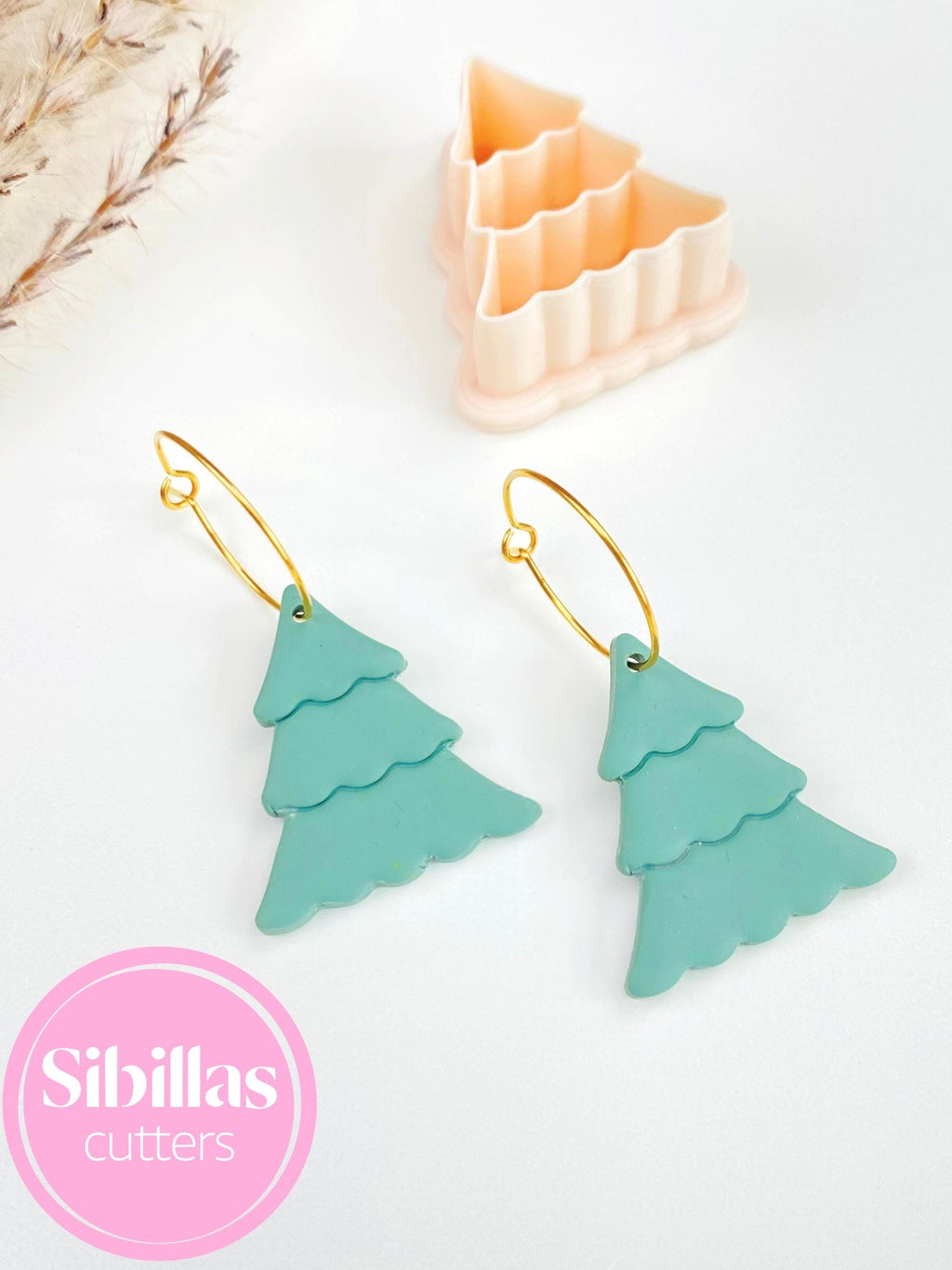 Holiday polymer clay cutter shaped like a Christmas tree for earrings and crafts