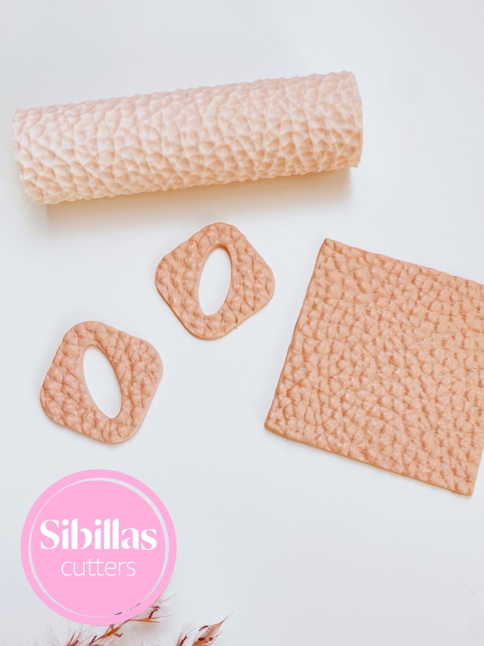 Leather-inspired clay roller for creating embossed designs in polymer clay and DIY projects