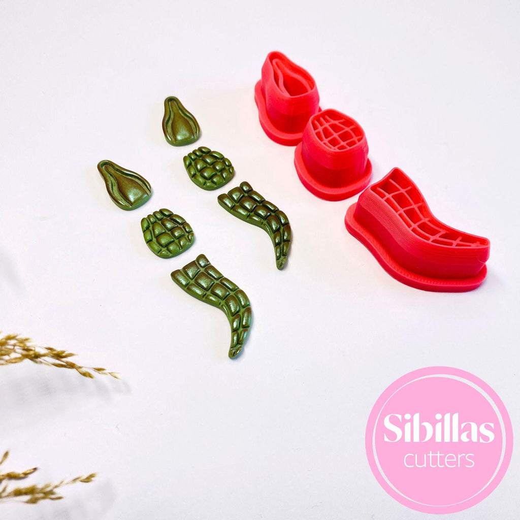 Alligator-shaped polymer clay cutter with embossed details for jewelry making"