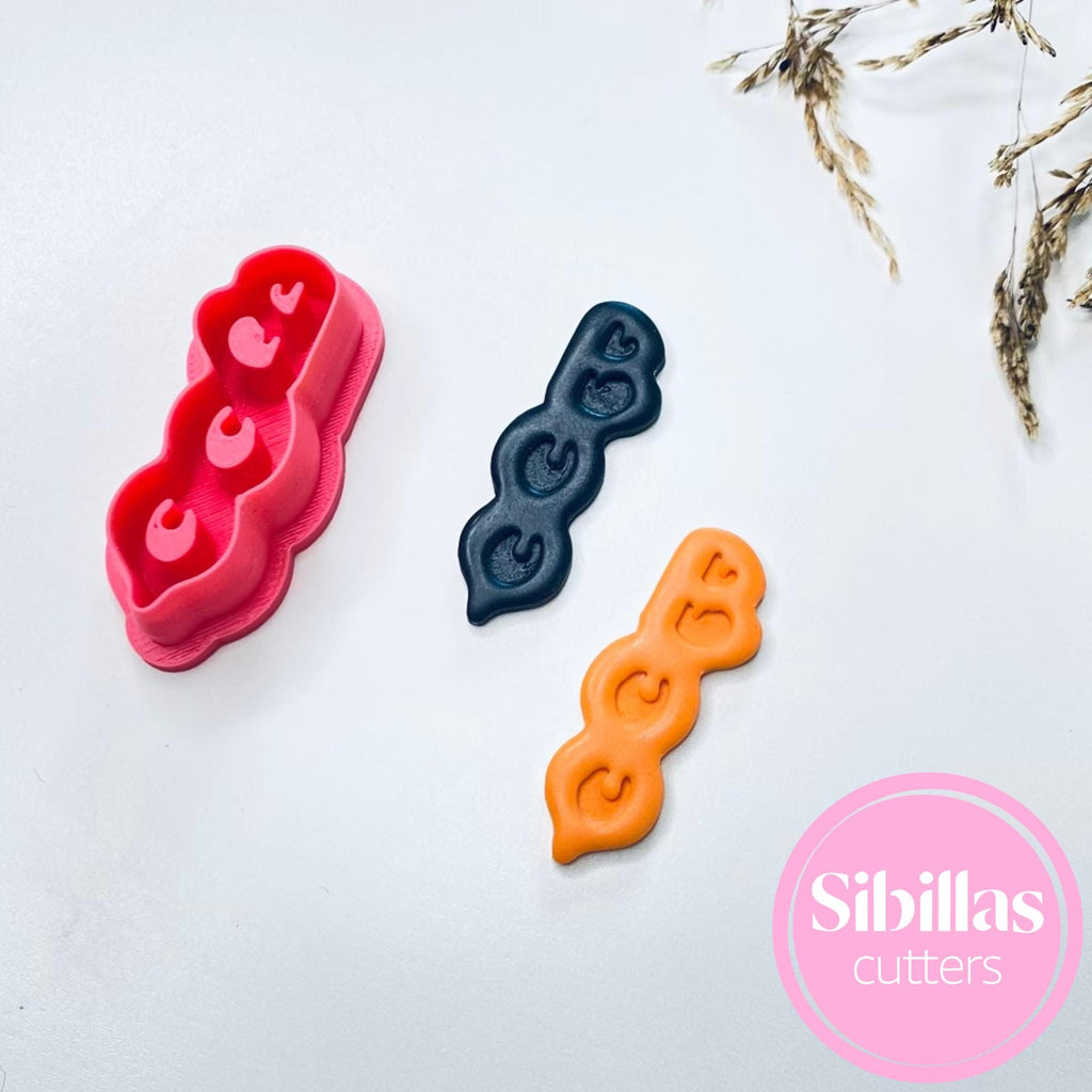 Festive polymer clay cutter with Boo Halloween design for earrings and charms"