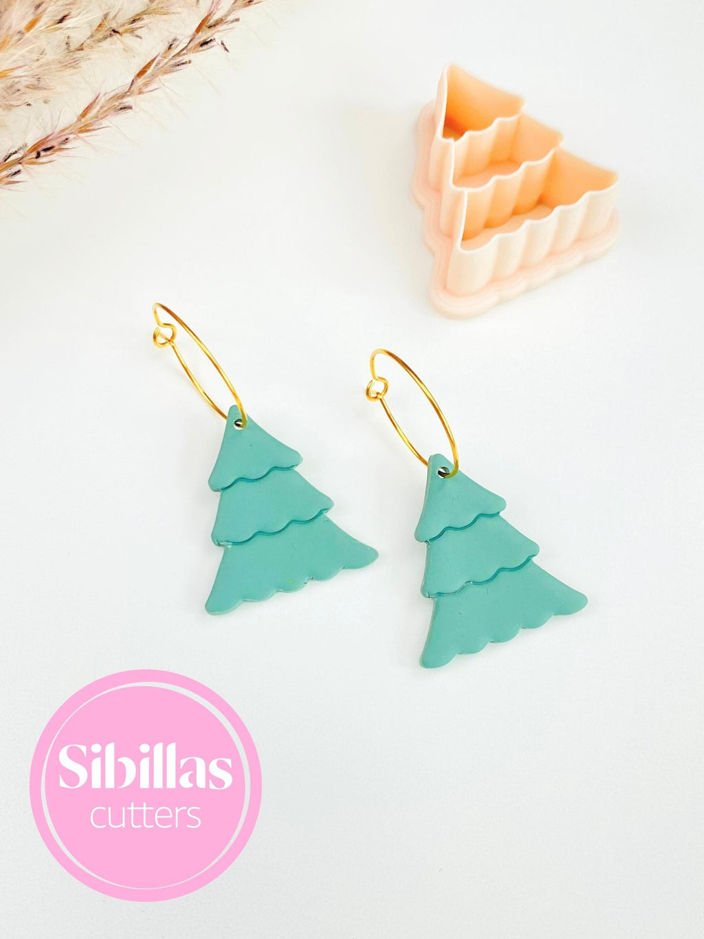 Polymer clay cutter featuring Christmas tree design for festive earrings and charms