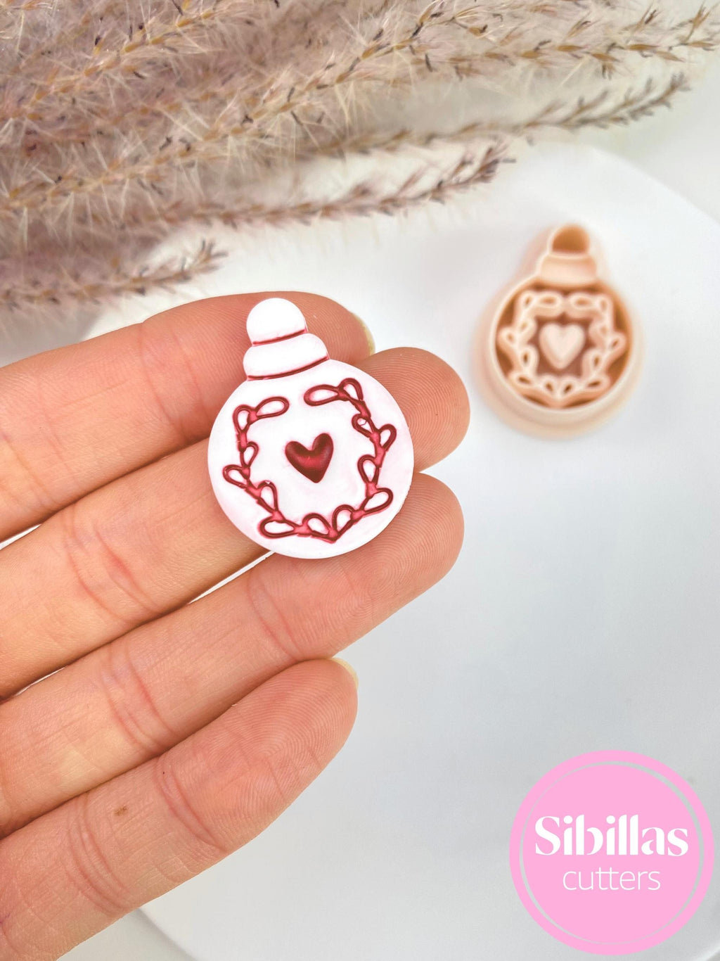 Scandinavian Christmas ball polymer clay cutters for making holiday ornament earrings and folk art clay crafts.