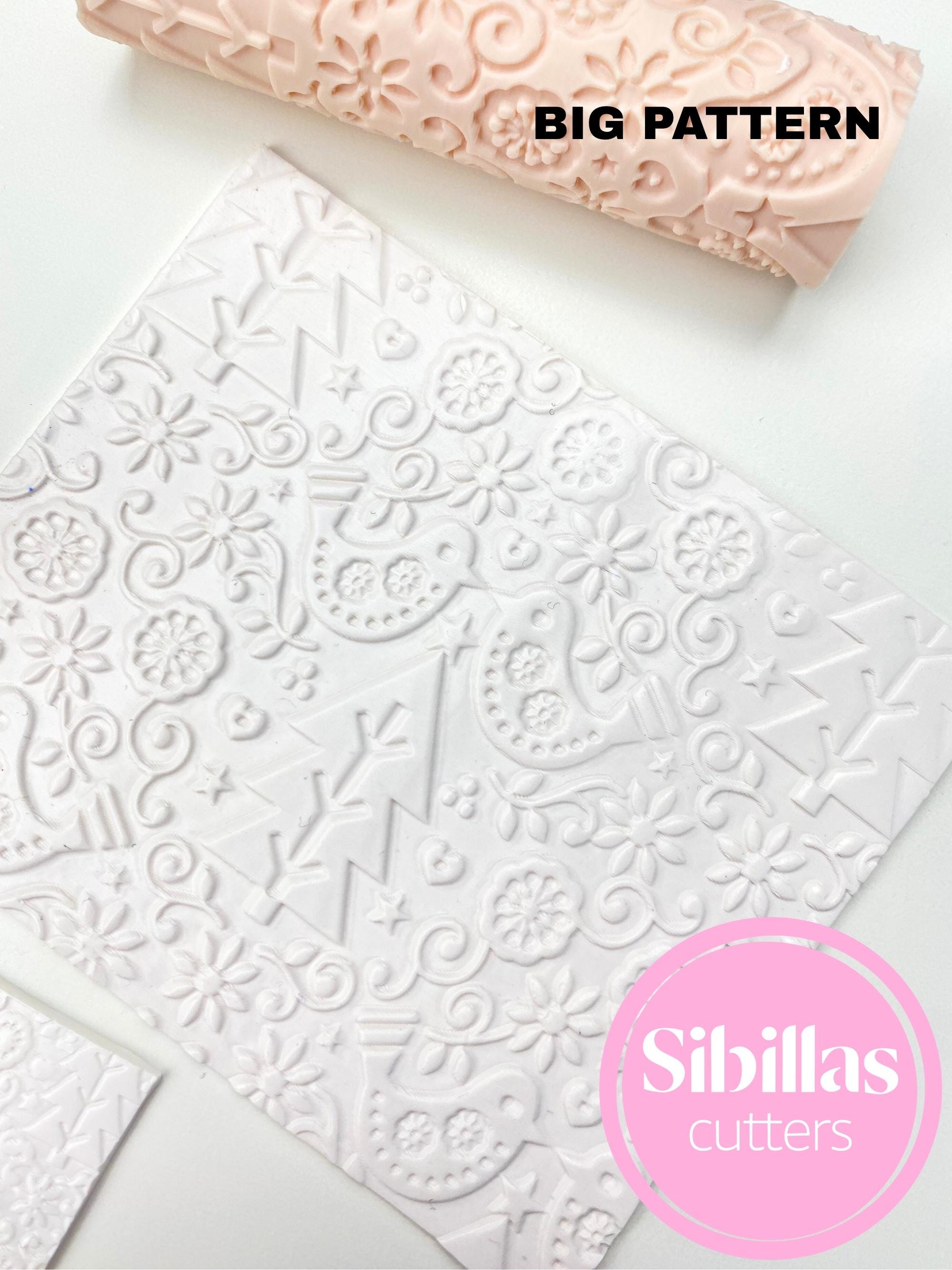 Clay texture tool featuring folk Christmas design for DIY polymer clay projects