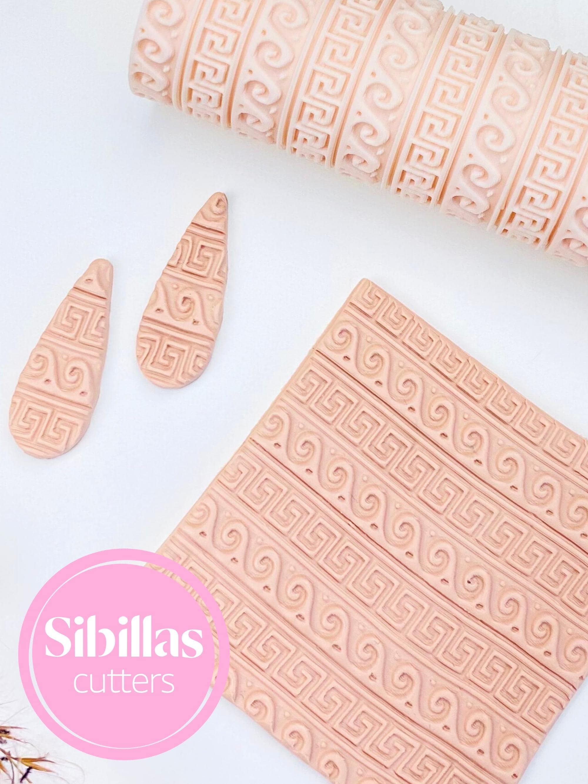 Polymer clay embossing roller featuring Greek patterns for handmade crafts and jewelry