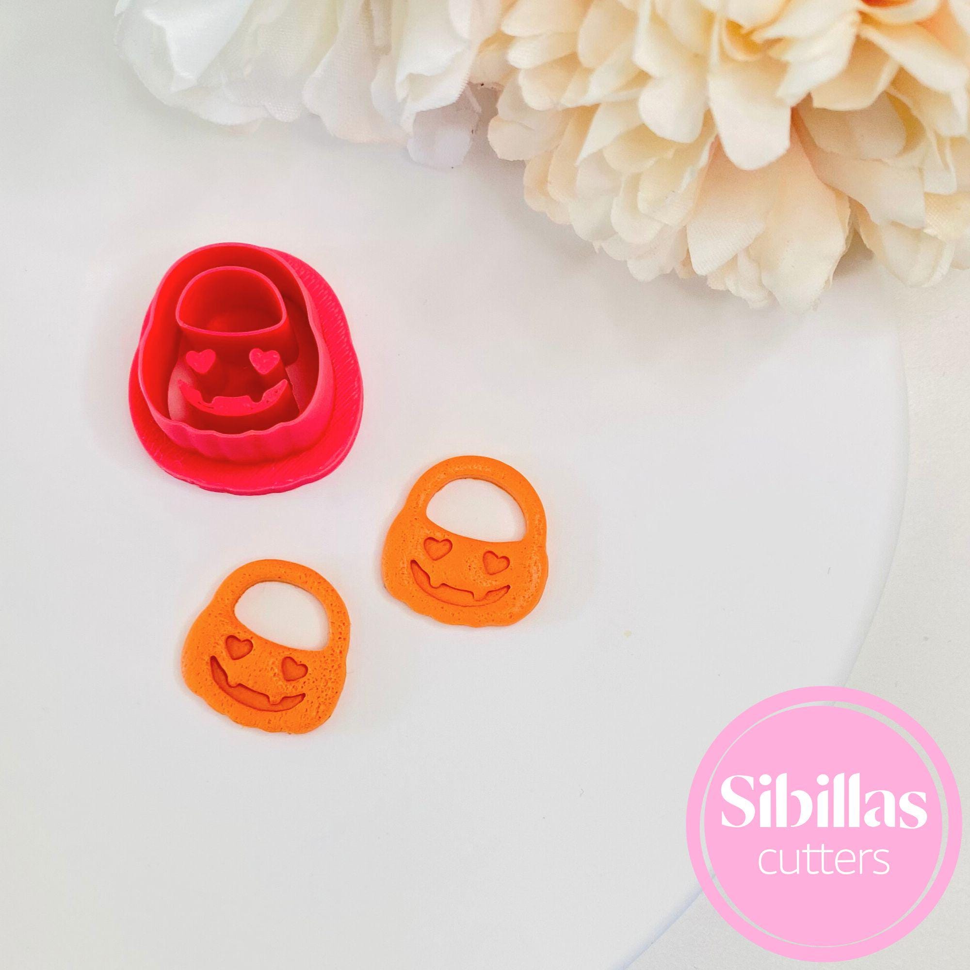 Polymer clay cutter shaped like a pumpkin basket for festive Halloween jewelry