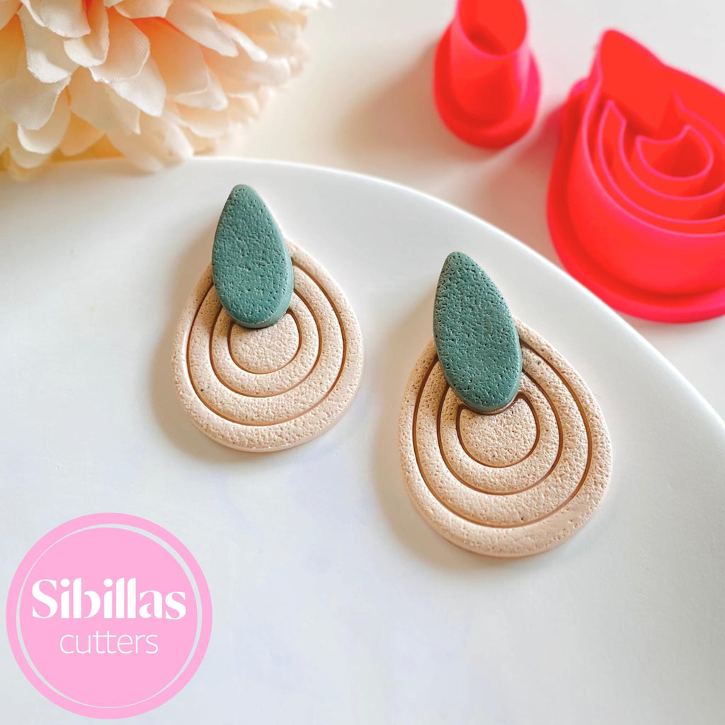 Polymer clay cutter featuring embossed leaf design for handmade geometric earring