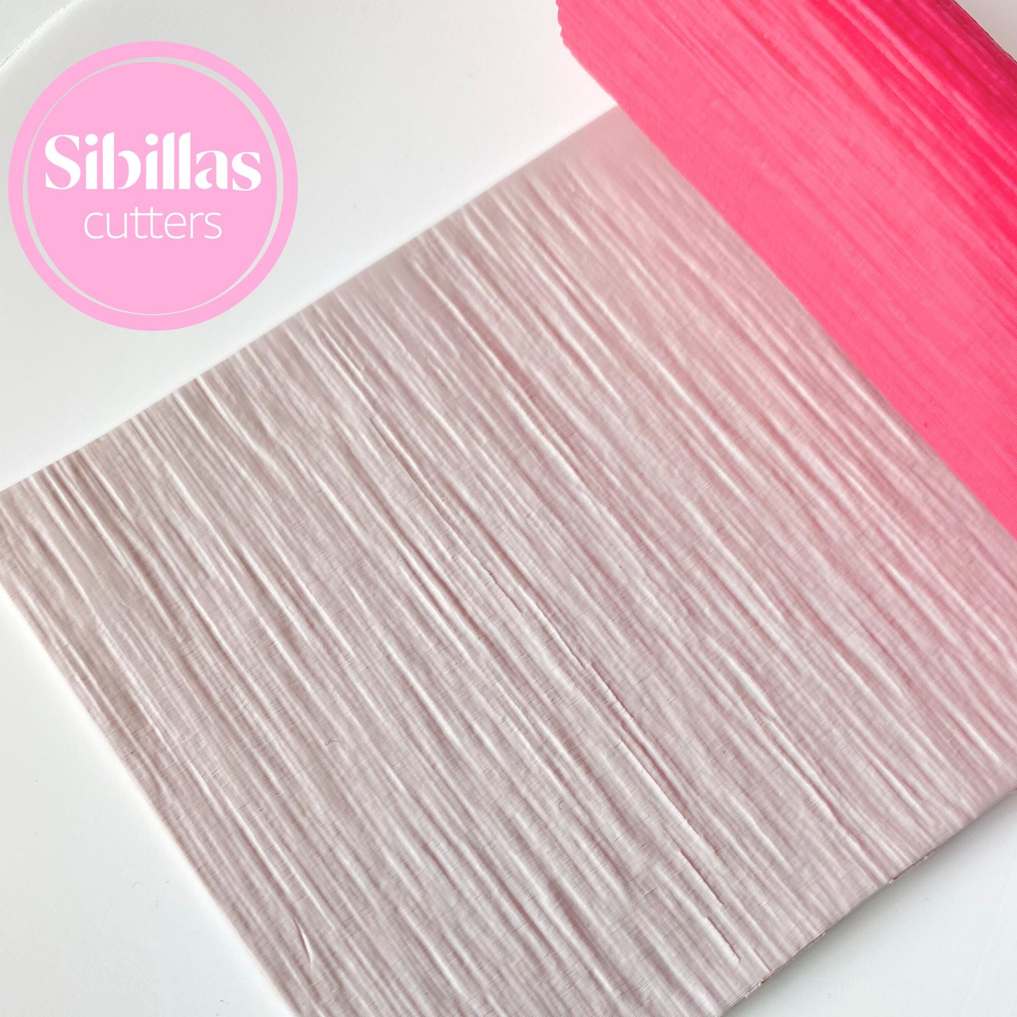 Polymer clay texture tool featuring wood bookshelf design for handmade crafts